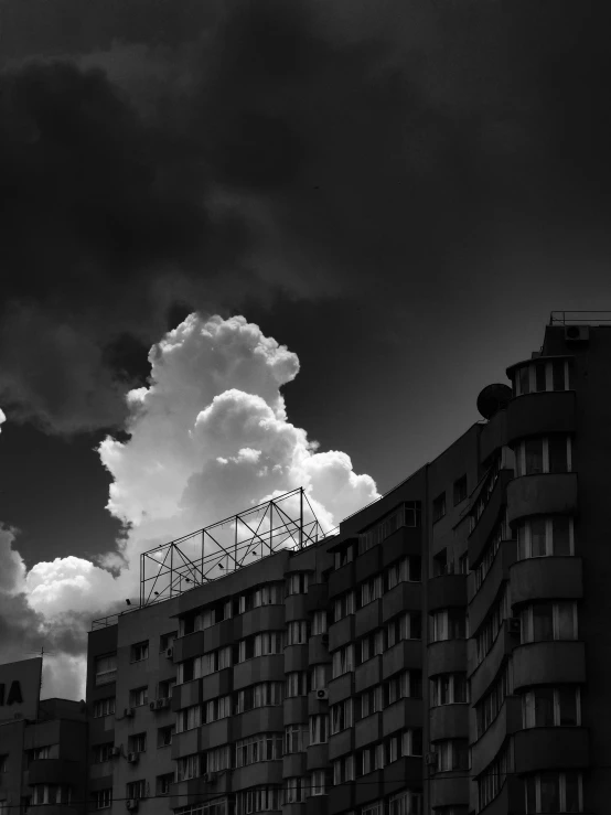 a dark stormy sky hovers over a residential building