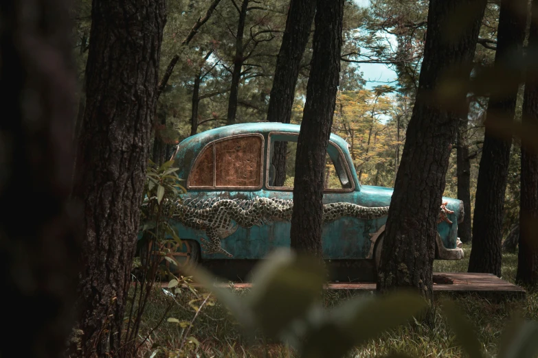 an old abandoned truck sits in the woods