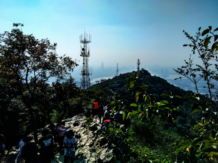 people walking uphill on a foggy day