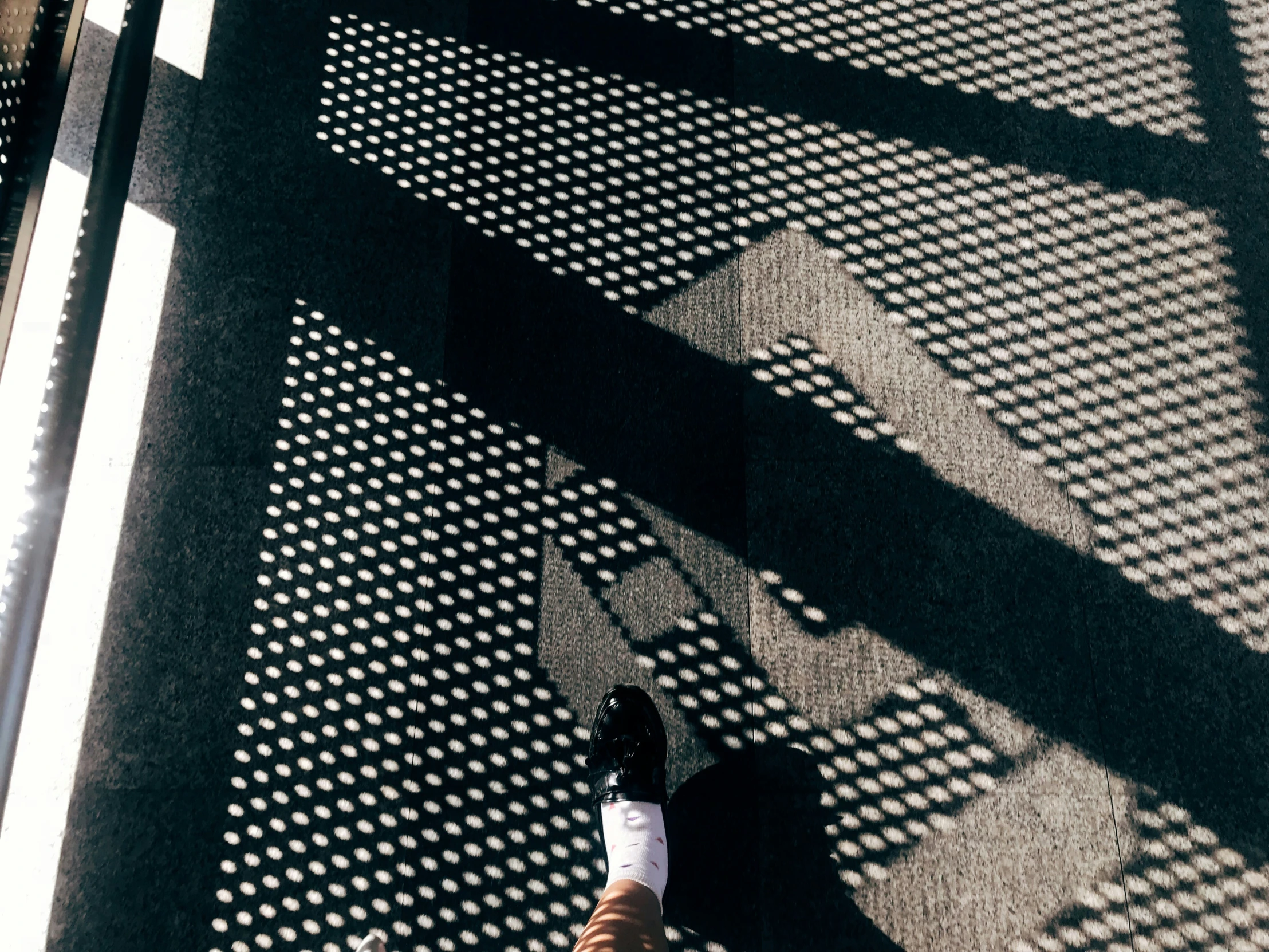 a person standing on the side of a street