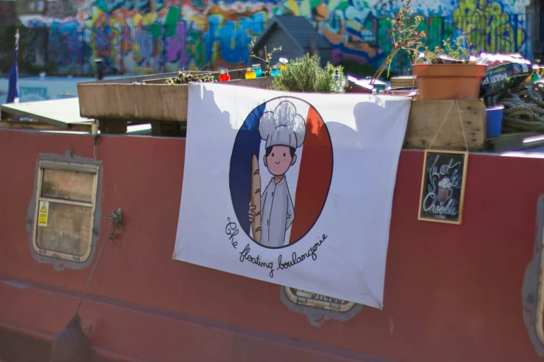 a flag with a cartoon of a chef on it