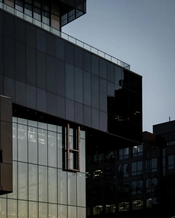 a plane flying past a building with many windows