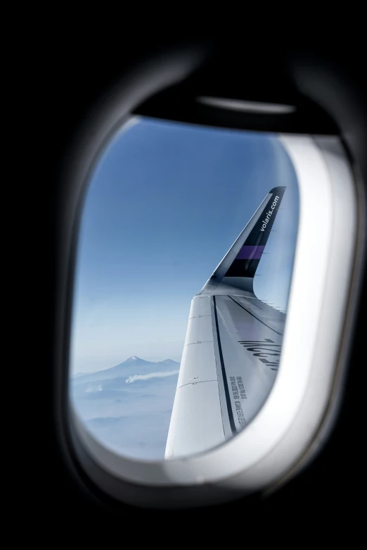 a view out of an airplane window into the sky