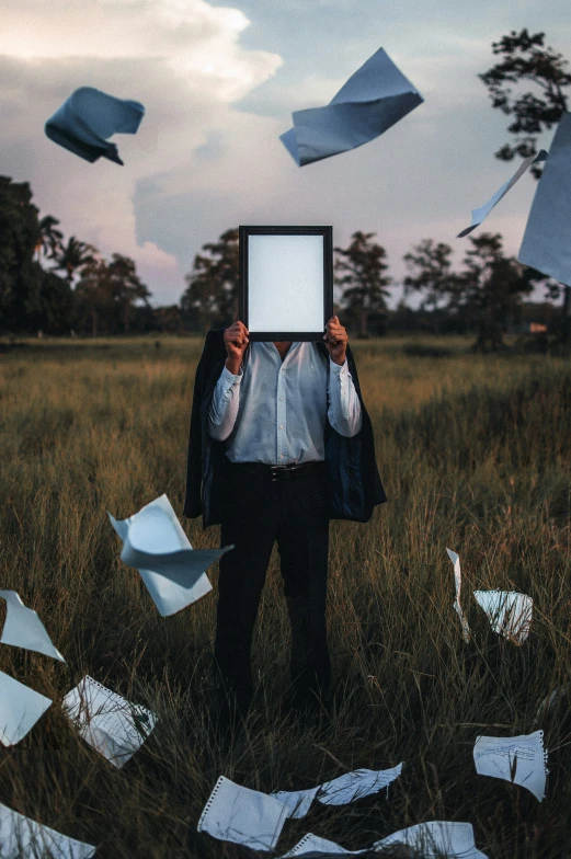 an altered pograph of someone holding up a white board