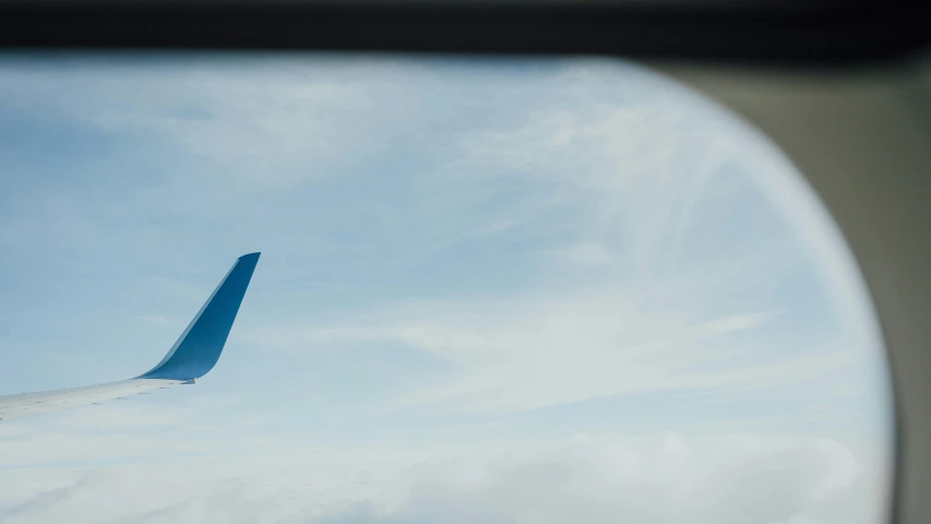 an airplane wing seen through an airplane window
