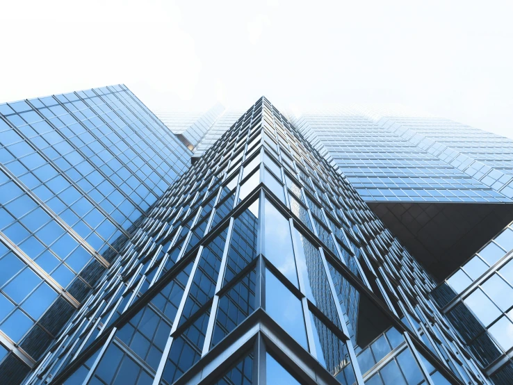 the windows of an upward building are in blue