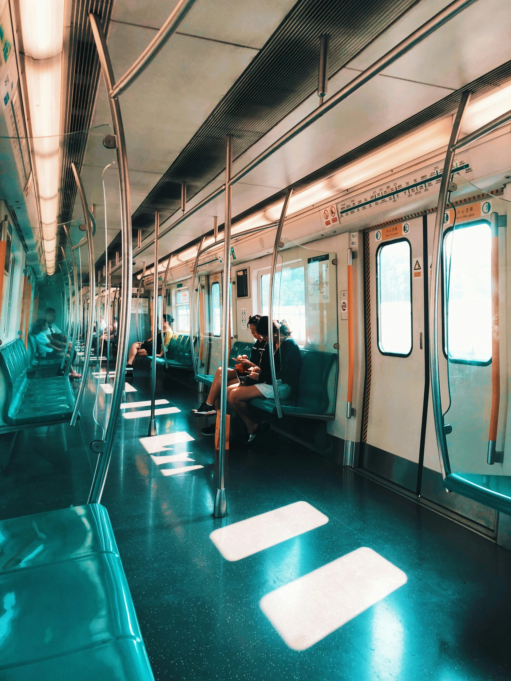 the interior of a subway car is clean and empty