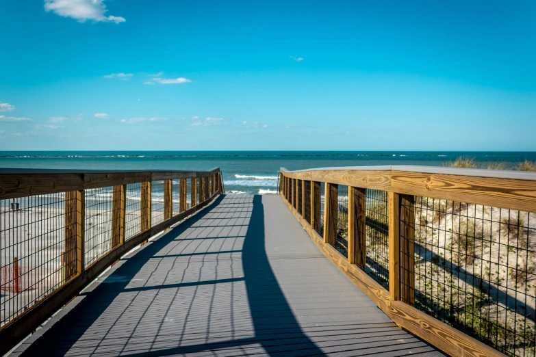 the walkway to the beach leading out towards the water