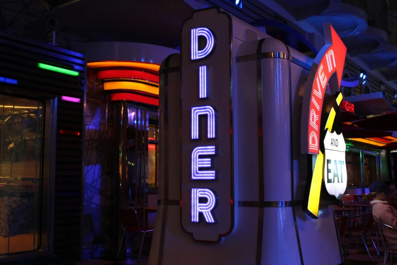 a silver pole sitting inside of a diner