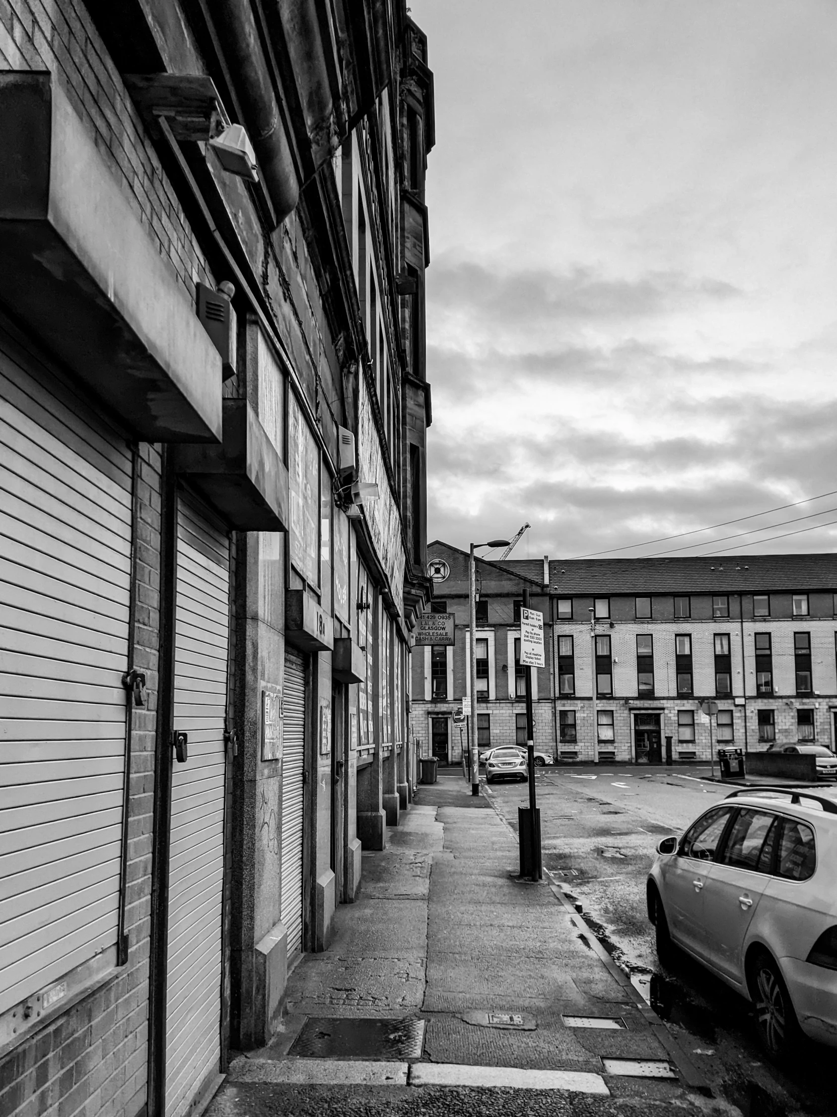 a street with two buildings on the opposite side of it