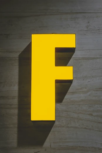 a picture of the letter f in yellow on the wall
