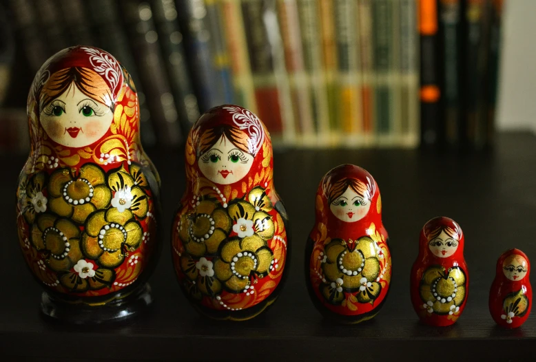 small red dolls with yellow flowers and red heads