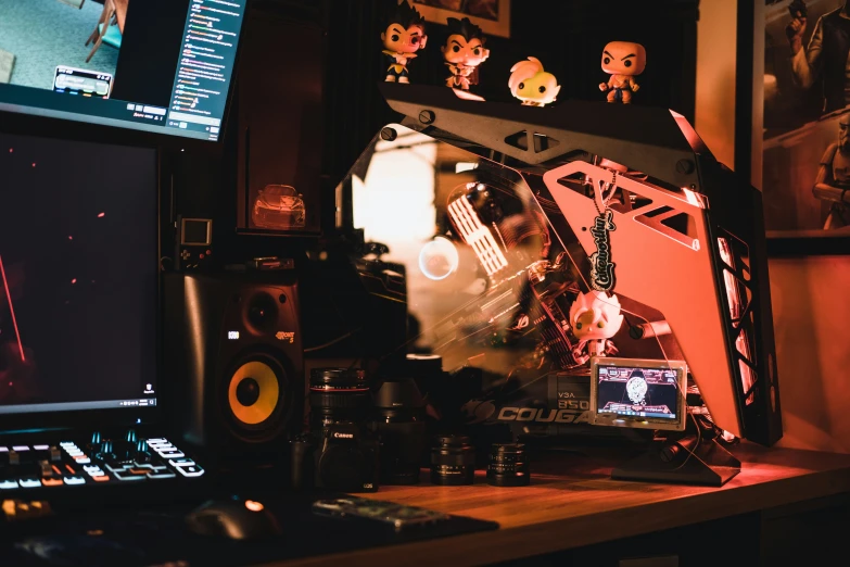 a computer with multiple electronic devices on the desk