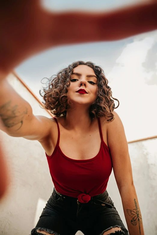 a woman that is standing next to a wall