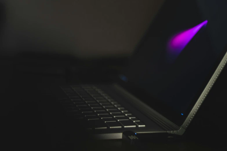 a computer keyboard sitting on top of a table