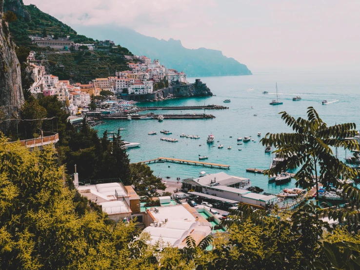 a city filled with lots of boats on top of a lake