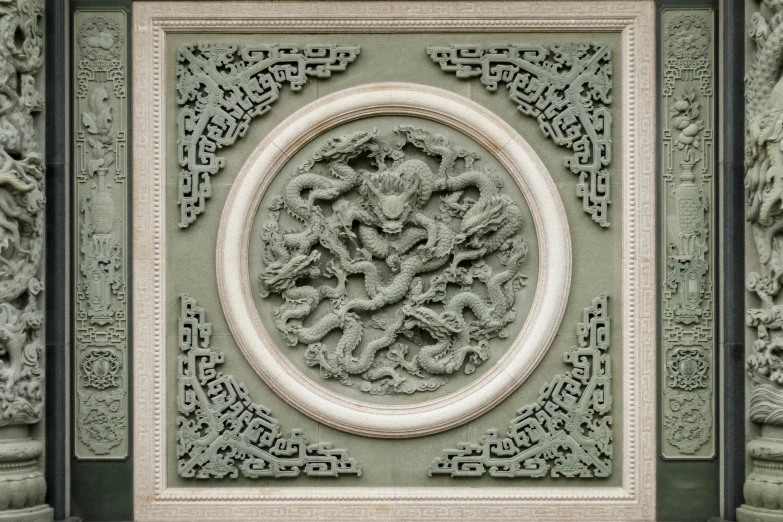 decorative carvings in stone on the front of an oriental building