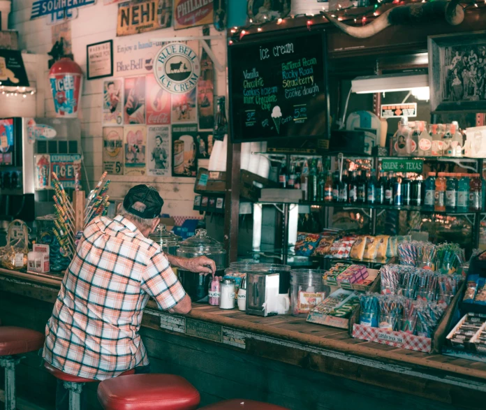 there is a man behind the bar