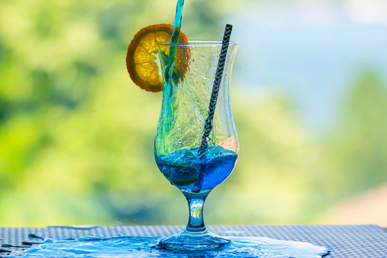 a glass with an orange slice on the rim