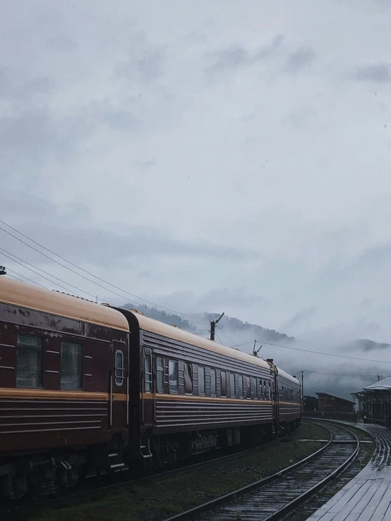 people standing on the platform beside the train