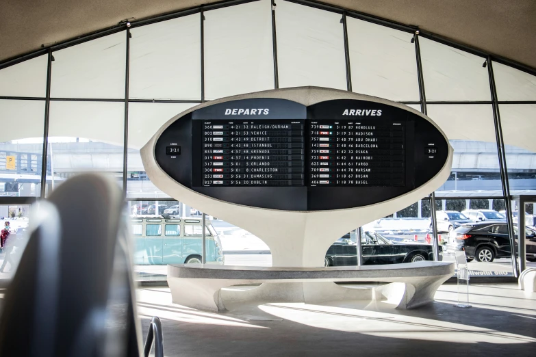 an airport with the bus station departure clock