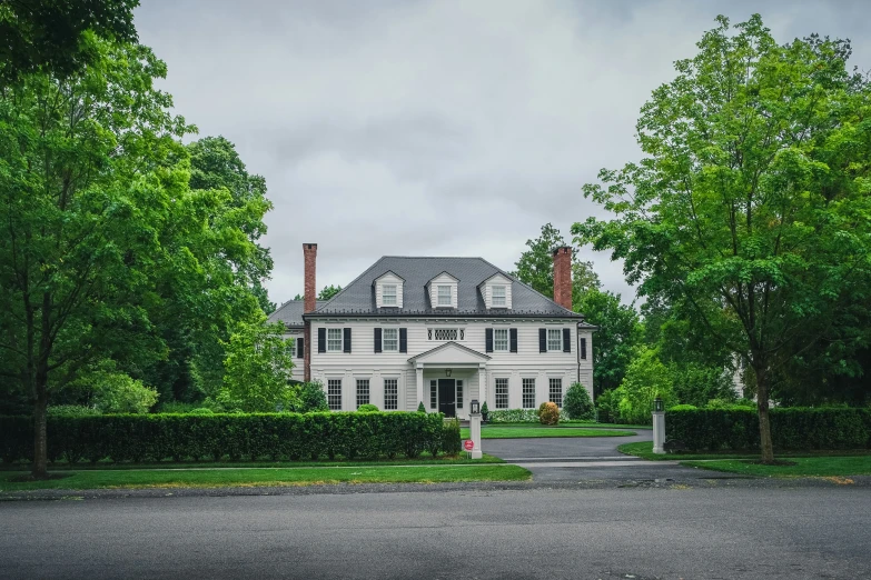 a house with an entrance and many trees