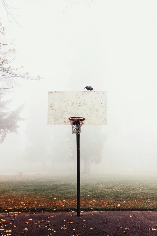 an empty basketball court with a white board