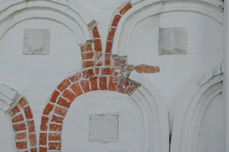 a red and white mural on the side of a building