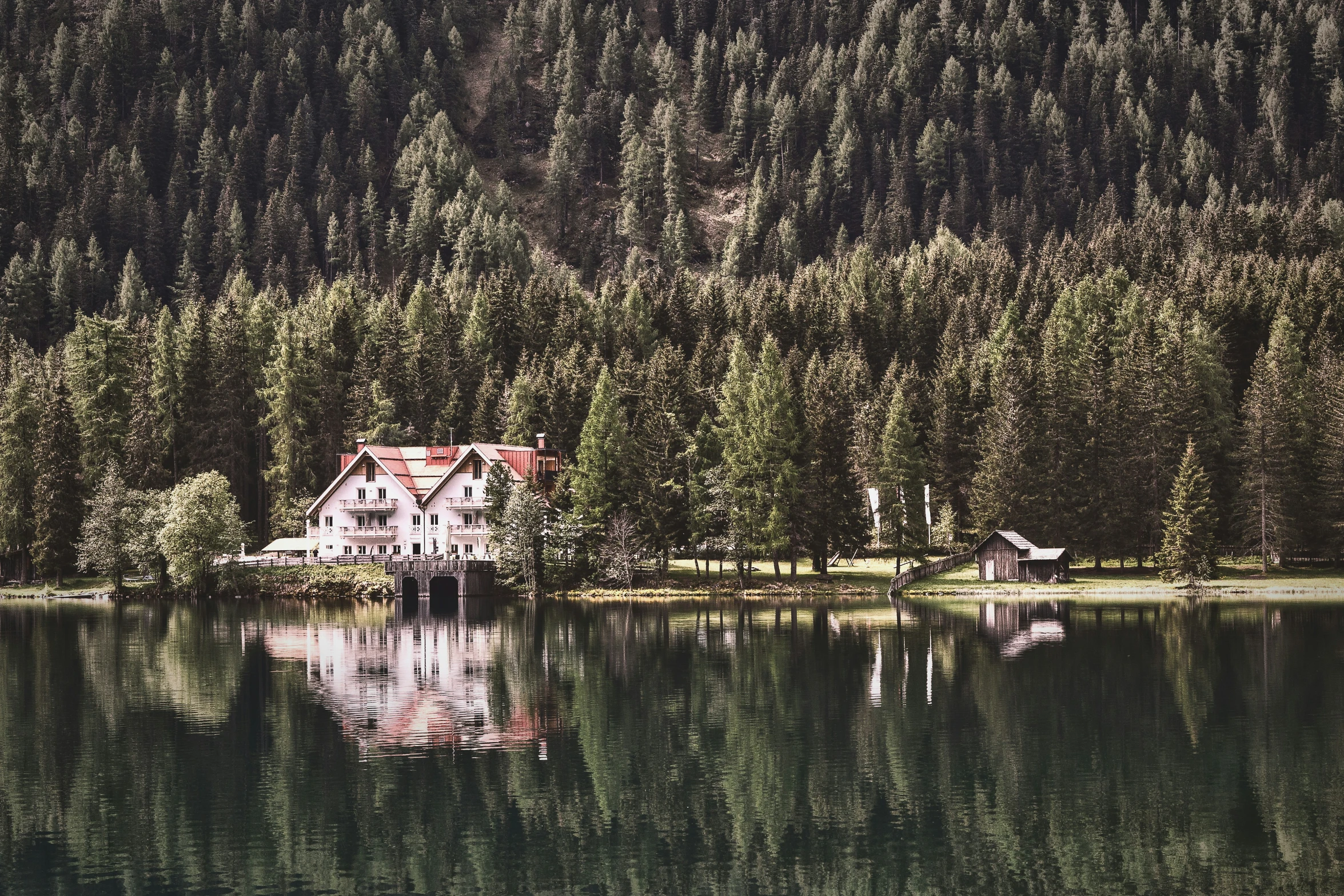 a lake that has trees on each side of it