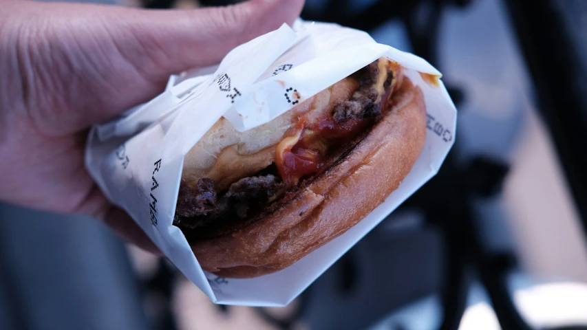 a close up of a person holding food