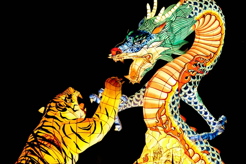 a dragon and a tiger in motion on display