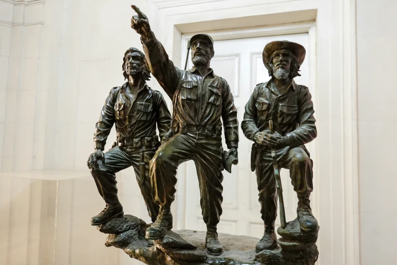 a couple of statues sitting on top of a table