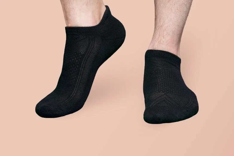 a person wearing socks with no socks on their feet