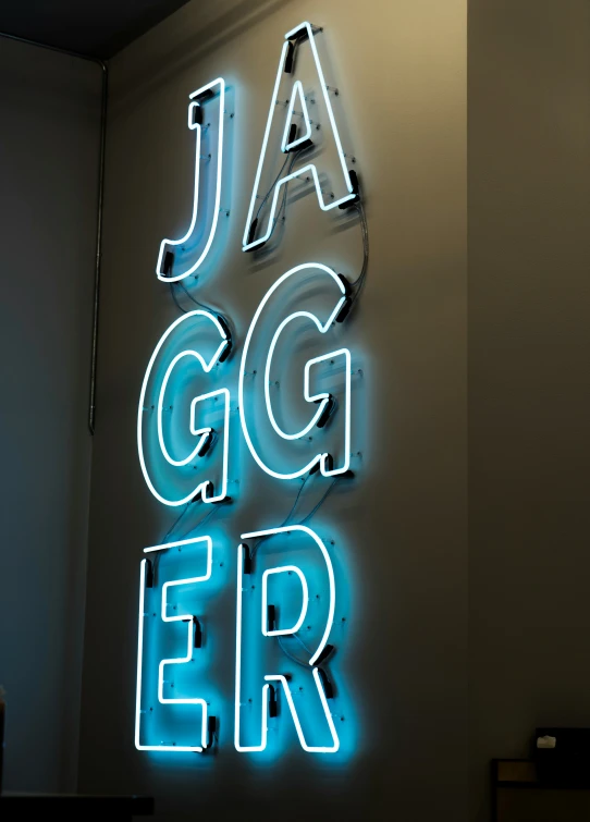 the neon sign that reads jag & err