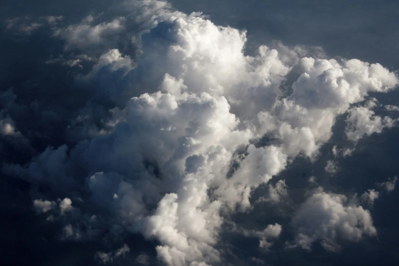 a view from an airplane looking out over the clouds