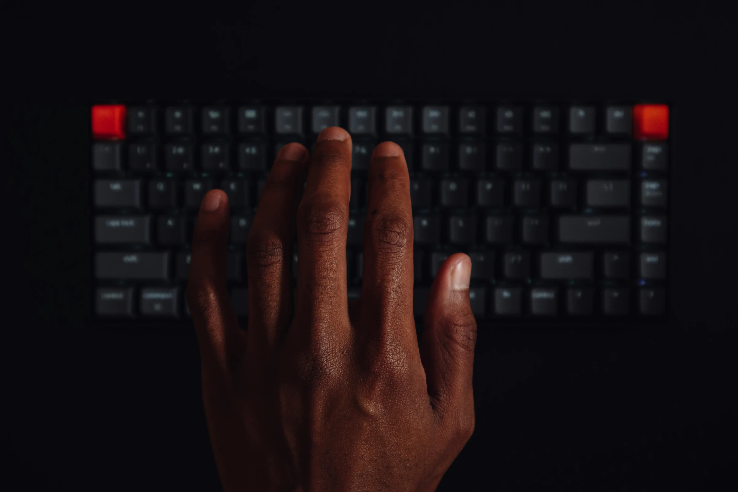 an image of a hand typing on a keyboard