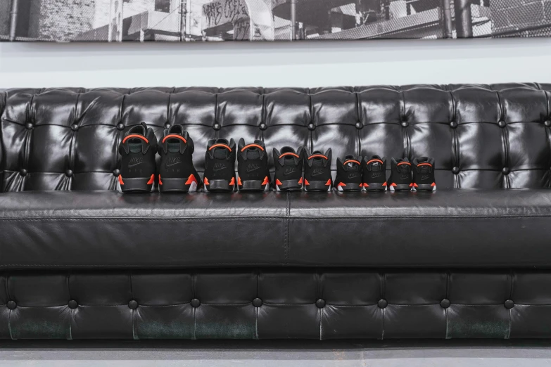 a black couch with a black headrest on it