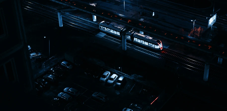 aerial view of train tracks and traffic at night