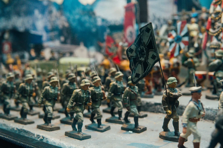 toy soldiers standing on a platform with flags