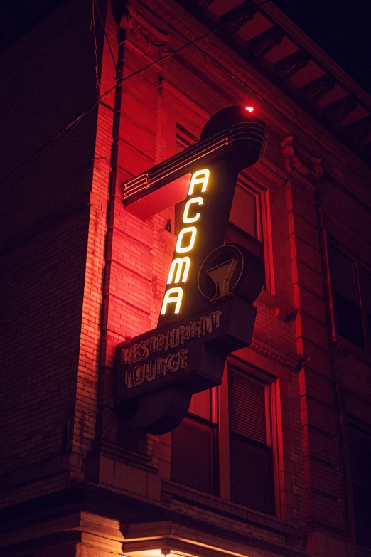a red neon sign for cocobe coffee in front of a building