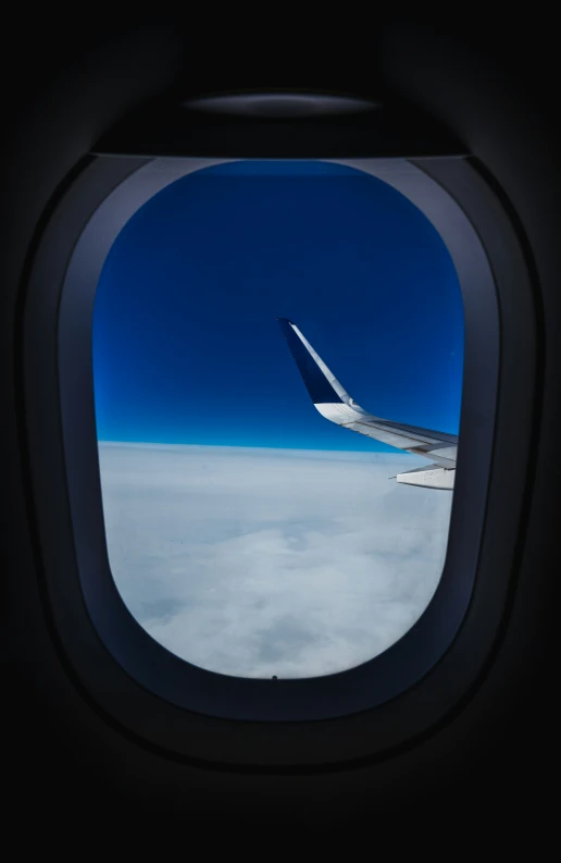 an airplane's window showing the view out of it