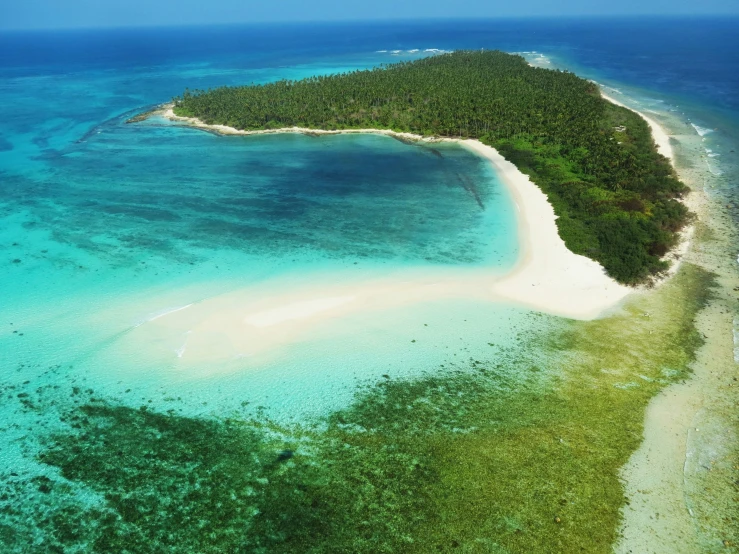 an island is in the middle of a body of water