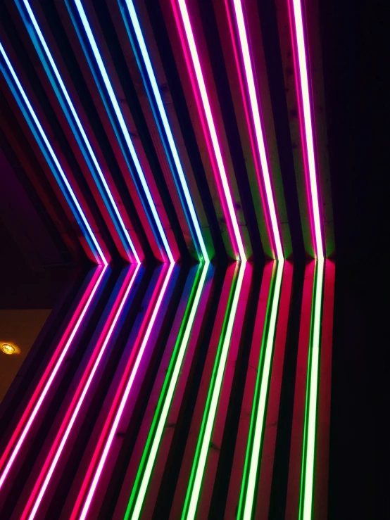 brightly colored lights line the ceiling and walls