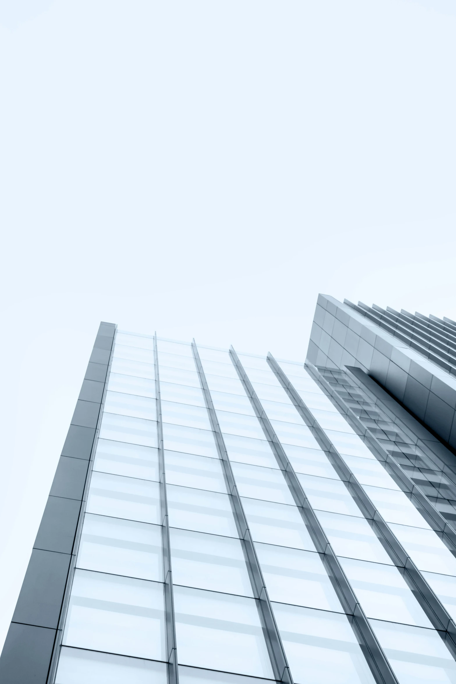 the top of a very tall building with lots of windows