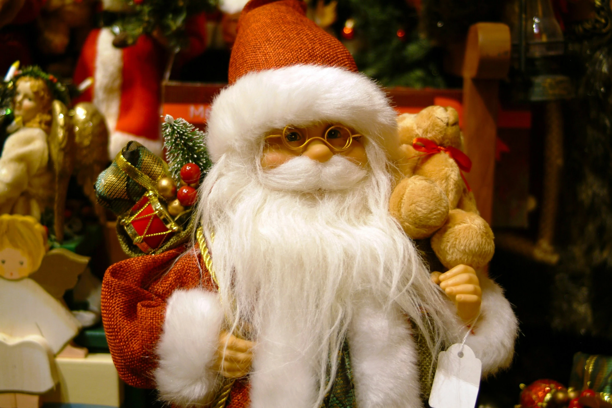 a close up view of santa clause toy with teddy bears