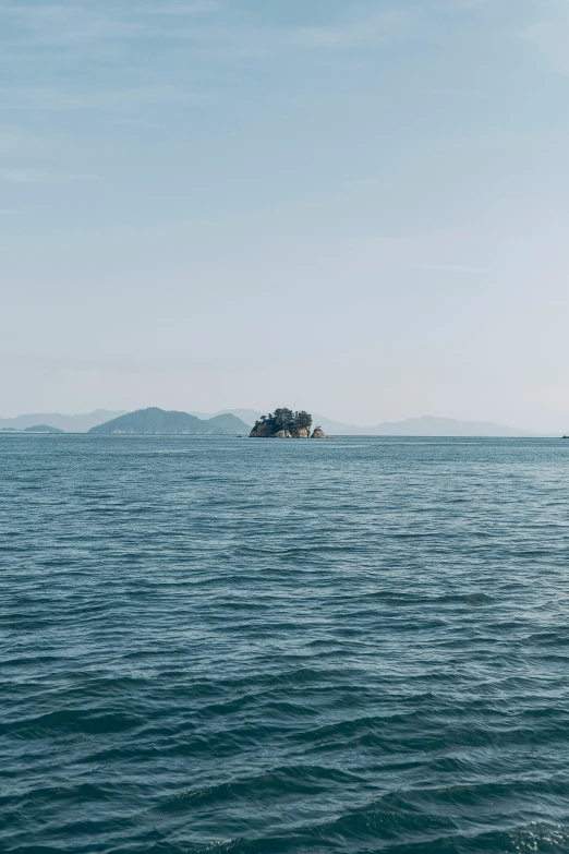 some sort of small island off the coast of water