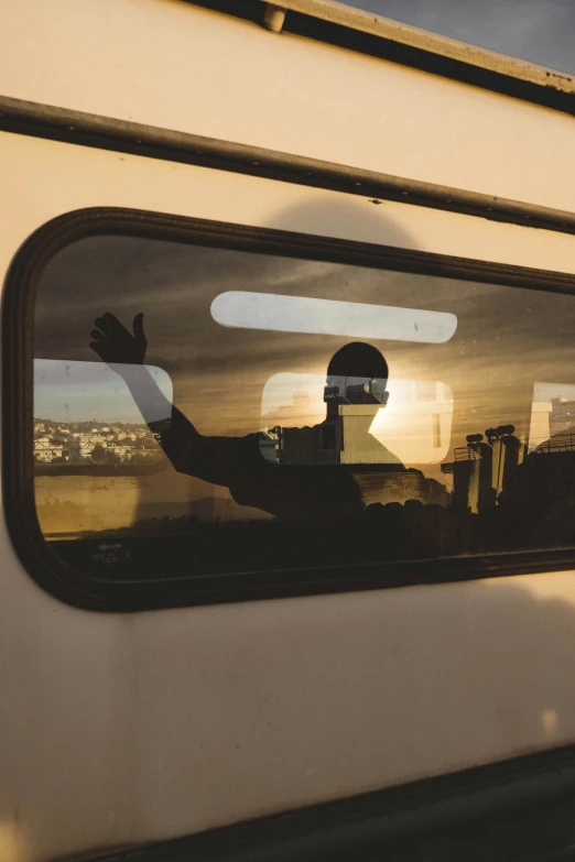 the reflection of a man in the side view mirror