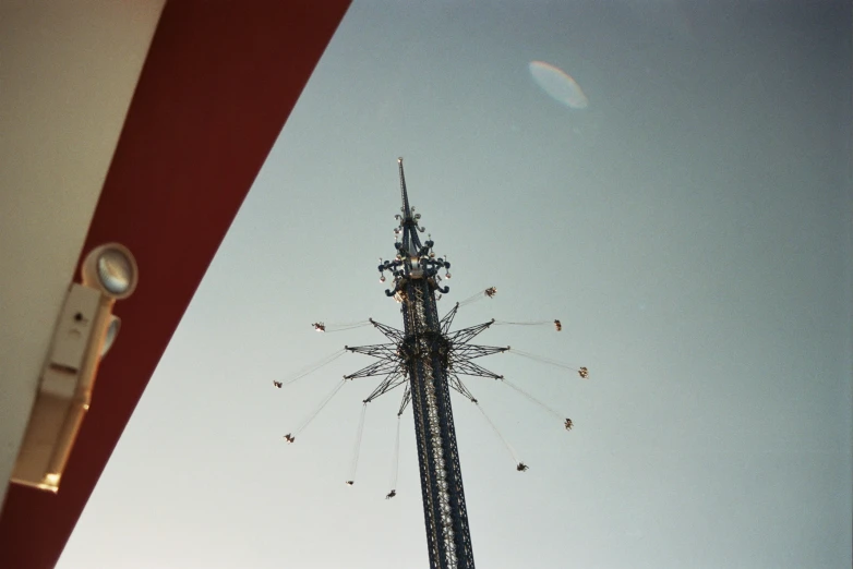 a view of a very tall clock tower through a phone