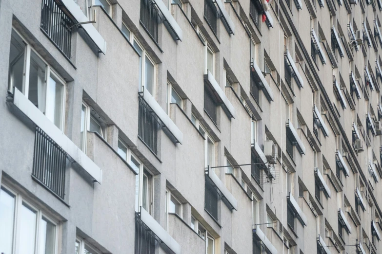 a very tall building with many windows and a clock