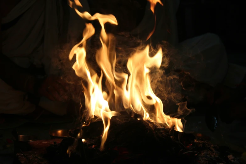 a burning fireplace with lots of white and yellow flames